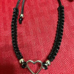 Black and Silver Heart Bracelet beaded one size fits all . Adjustable .
